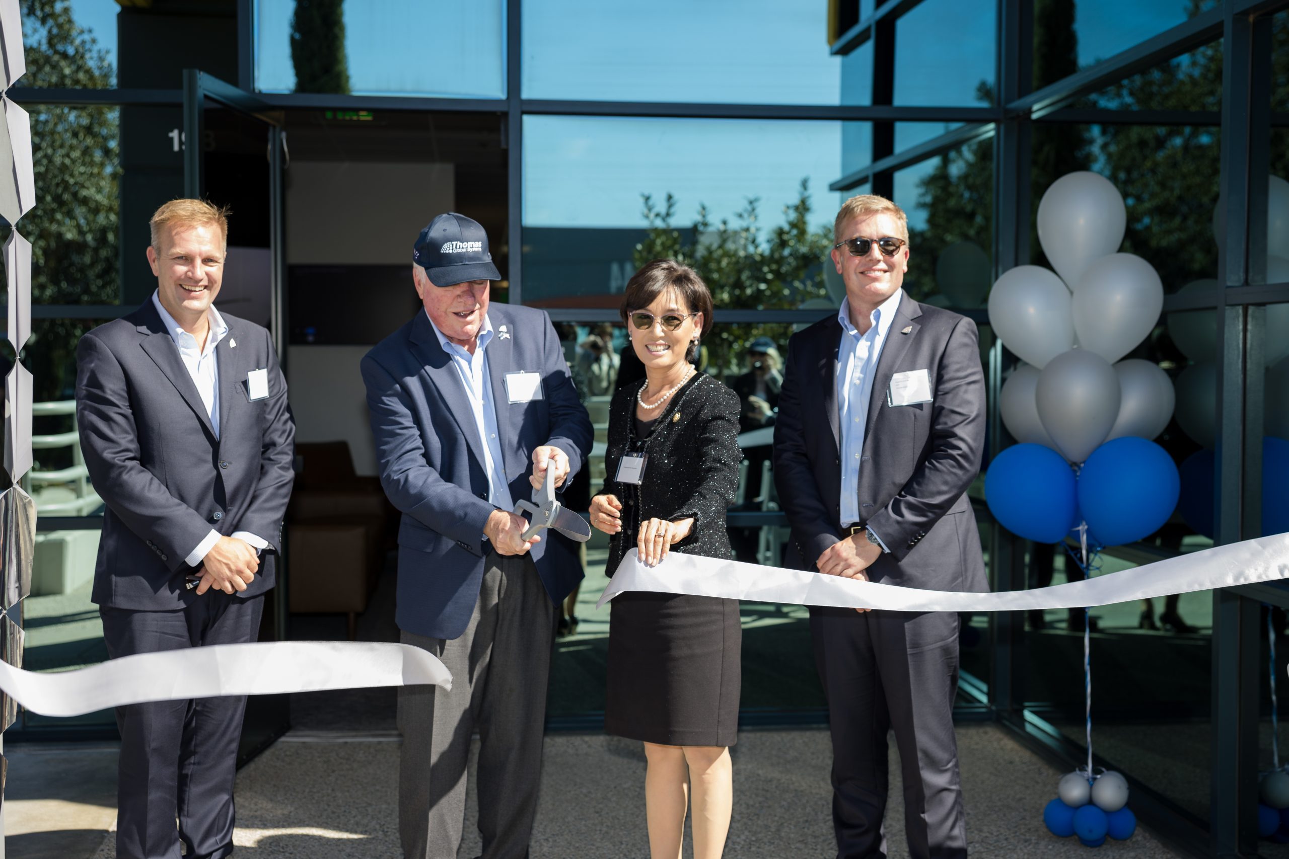 Company leaders and Congresswoman Young Kim cut a ceremonial ribbon at the opening of the expanded Irvine facility.